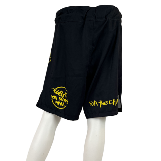 back view of protect ya neck mma on back left leg and for the children on back right leg black and yellow loose fit mma shorts for grappling