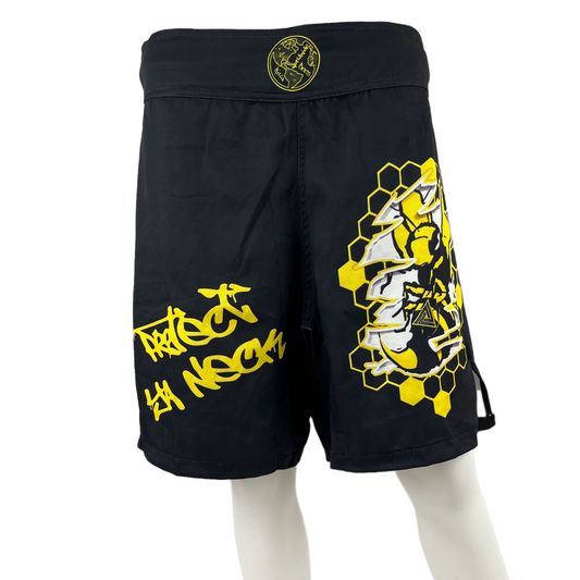 black and yellow loose fit mma shorts for grappling killa bees worldwide protect ya neck right leg killa bee ripping through honeycomb left leg